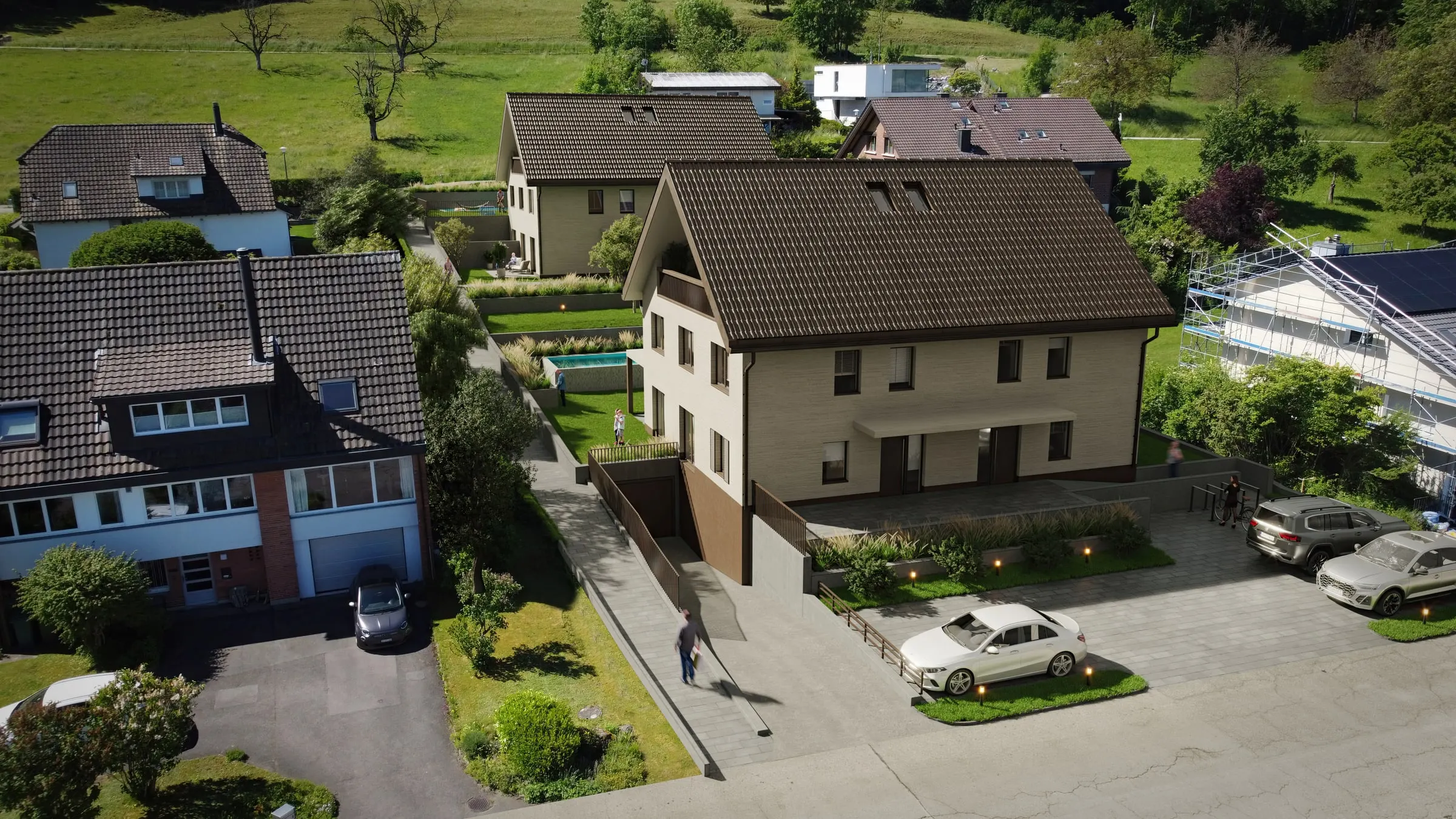 Visualisierung eines Doppeleinfamilienhauses mit Zufahrt zur Einstellhalle